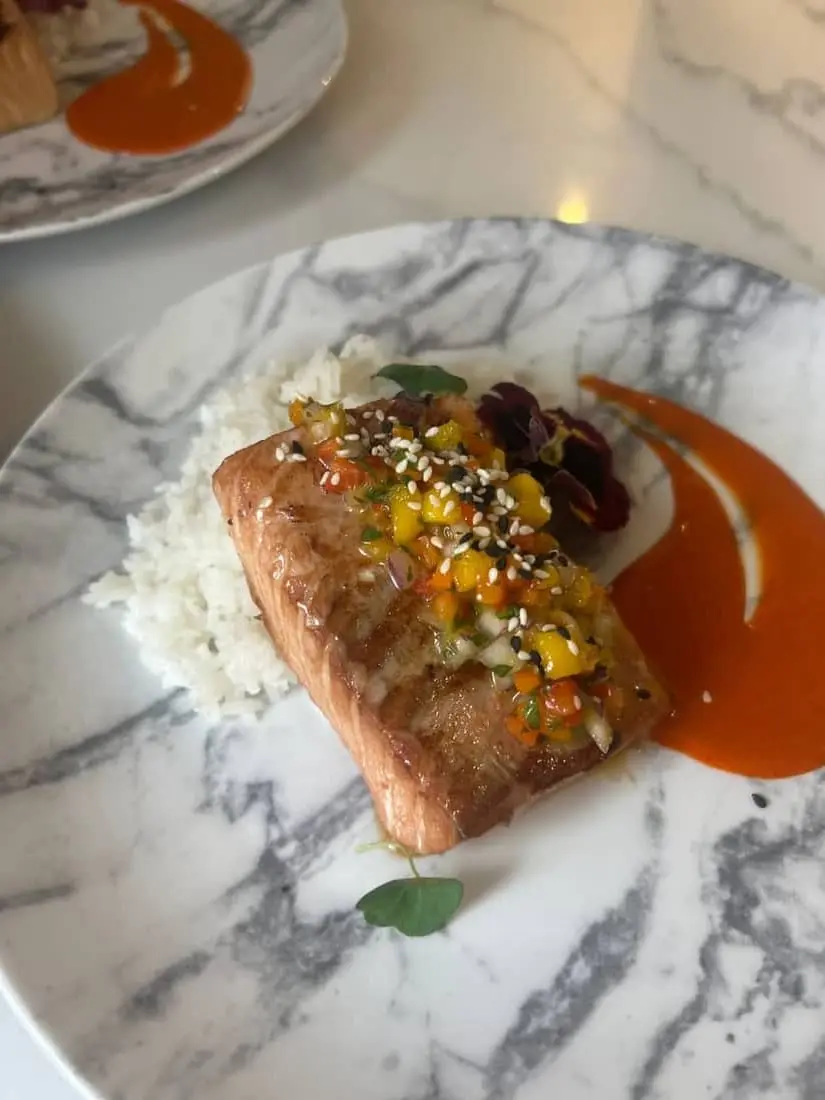 Seared salmon, jasmine rice, mango salsa, romesco