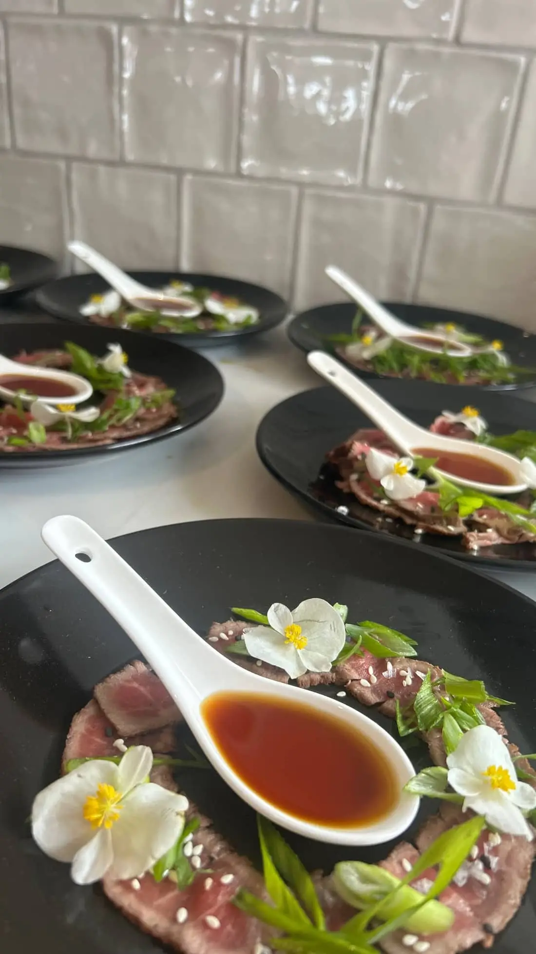 Beef tataki, ponzu, scallion, edible begonia