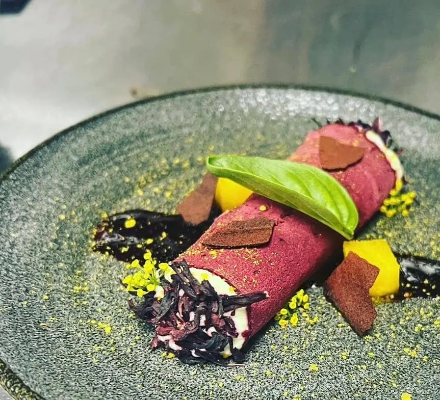 Beetroot-cured crepe, whipped cheese, chocolate, micro basil